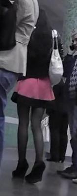 Upskirt black pantyhose of sexy girl in wedges heels