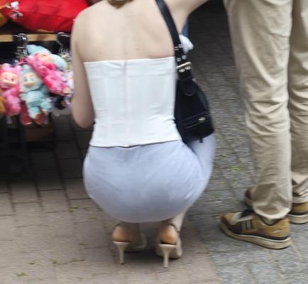 Girl in nude slingback heels and skirt